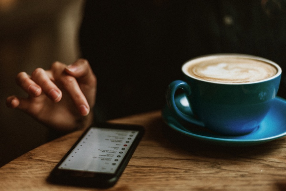 Starbucks cup of coffee and mobile